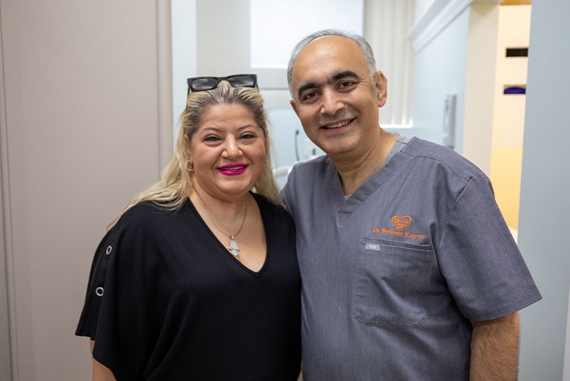 dental implants patient smiling with Dr. Benjamin Katayev